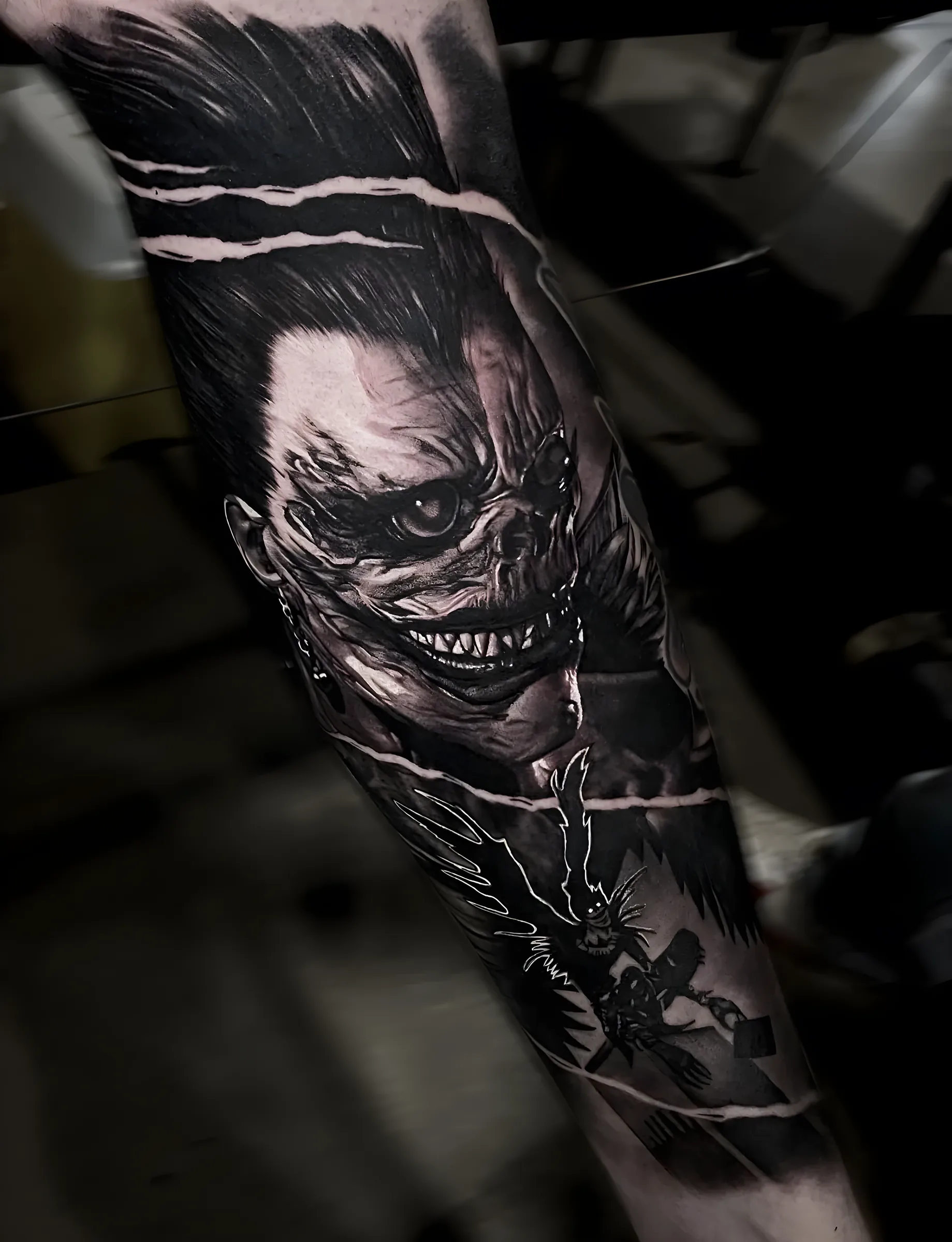 Creature realism black and grey tattoo