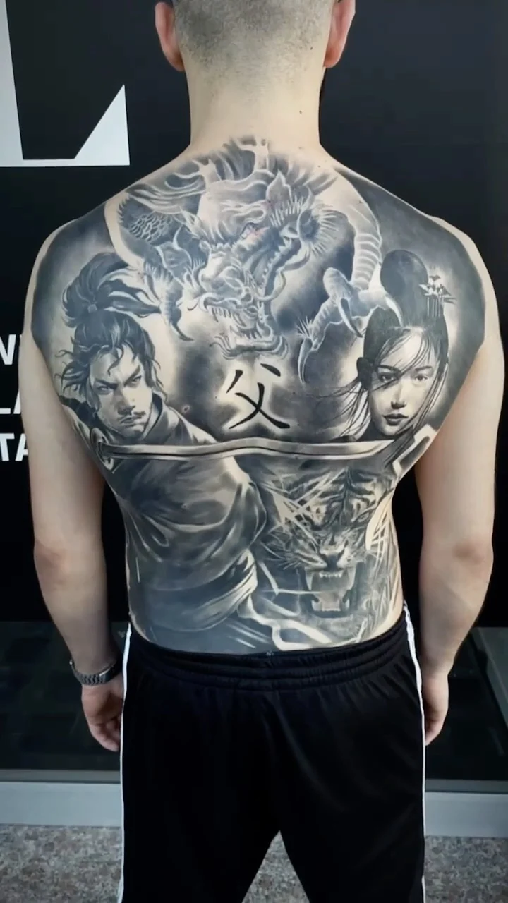 Fully healed black and grey back piece photographed in daylight