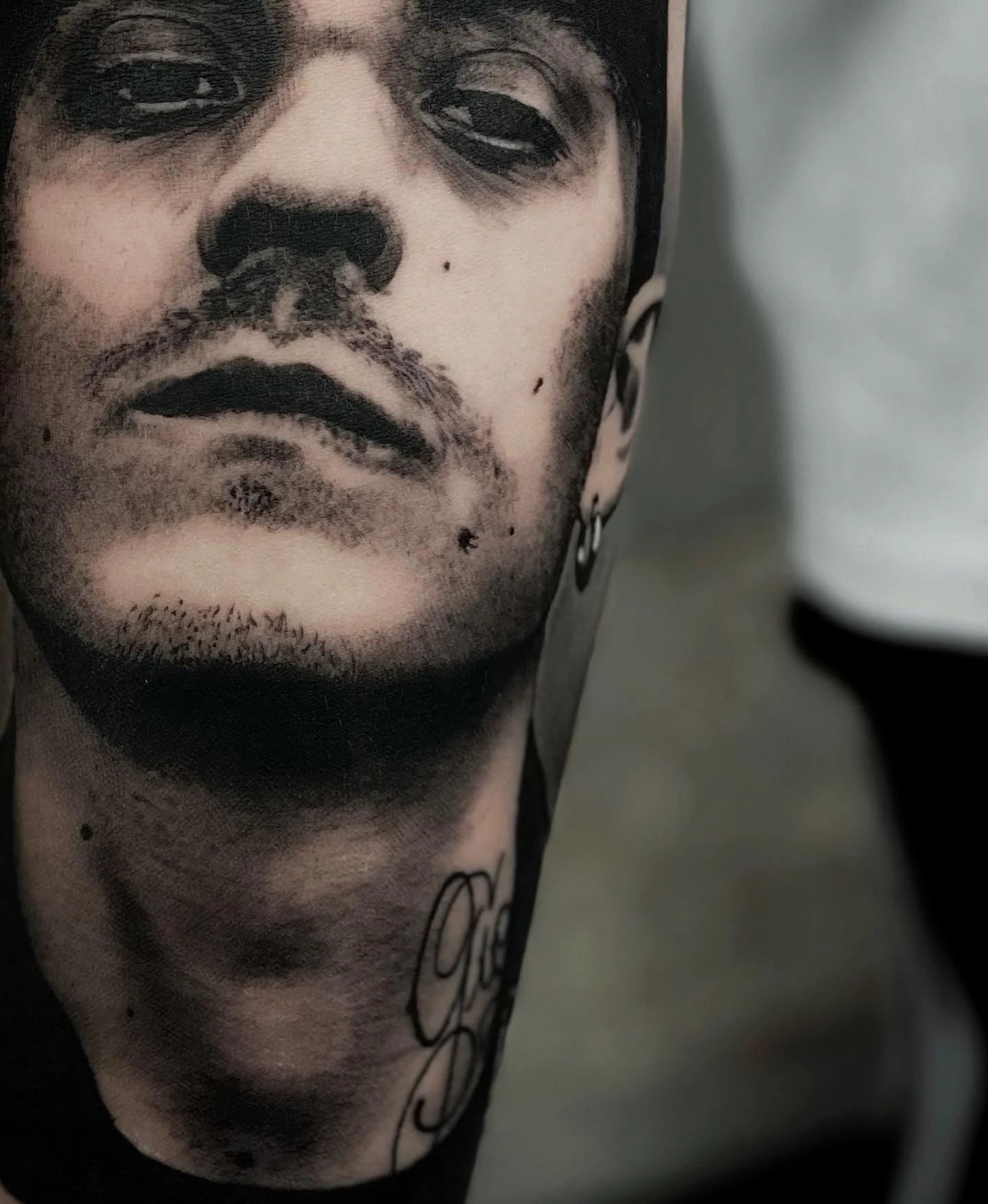 Black and grey rapper portrait on the arm