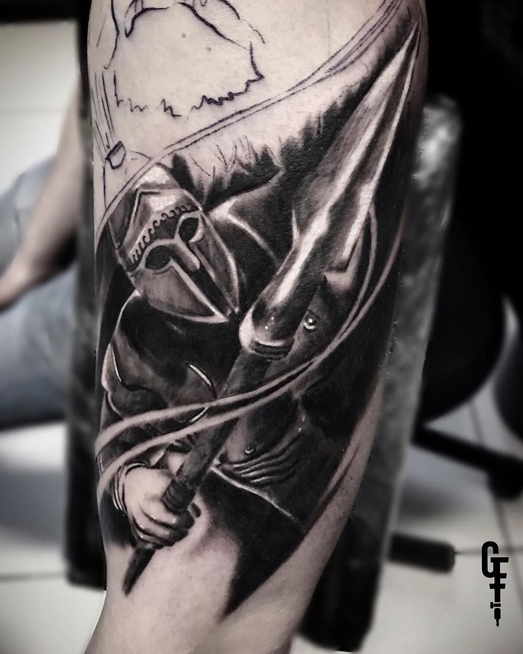 Black and grey Spartan half sleeve in progress